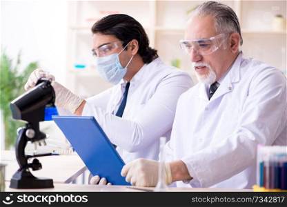 Two chemists working in the lab 