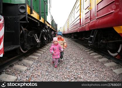 Two children between trains