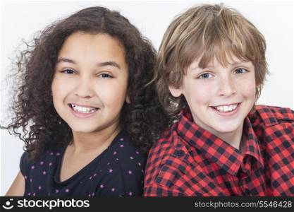Two children, blond boy and mixed race African American girl, having fun smiling white background studio shot