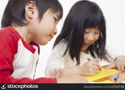 two children drawing