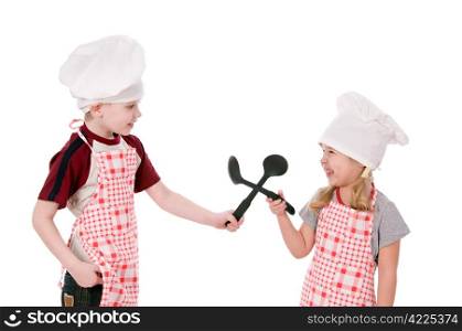Two children dressed in chef isolated on the white background