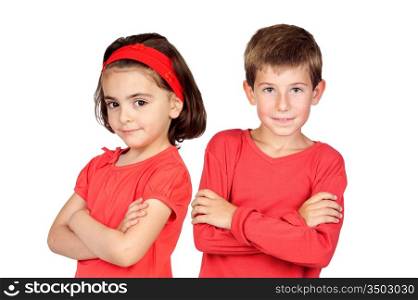 Two children in red with crossed arms isolated on white background