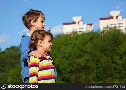 Two children, trees and houses