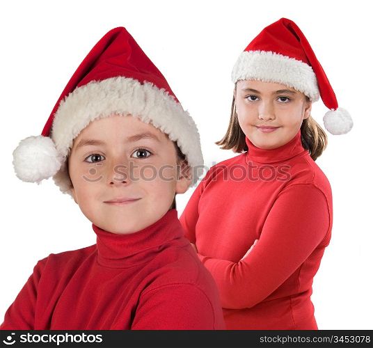 Two children with Christmas cap isolated over white background