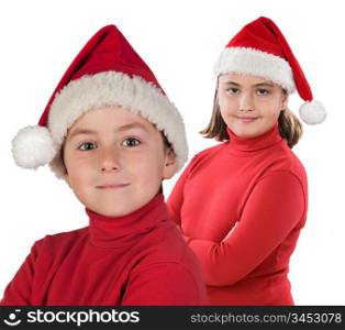Two children with Christmas cap isolated over white background
