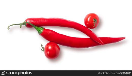 Two chili pepper and two cherry tomatoes top view isolated on white background