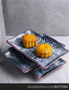 two chinese cakes on traditional plates