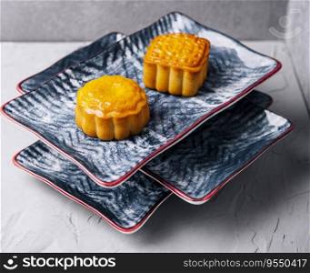 two chinese cakes on traditional plates