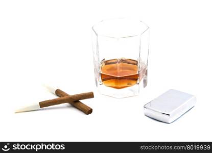 two cigarillos, lighter and glass of cognac closeup on white