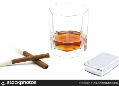 two cigarillos, lighter and glass of cognac on white closeup