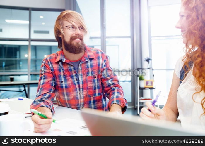 Two co-workers working together. Two co-workers working together in office