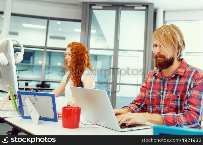 Two co-workers working together. Two co-workers working together in office