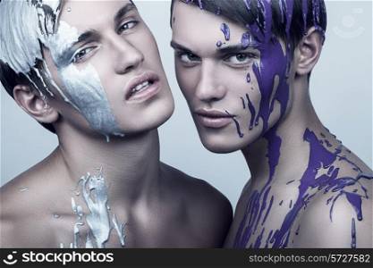 two cold men in silver and violet paint