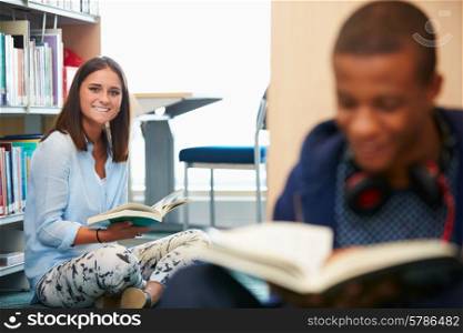 Two College Students Studying In Library