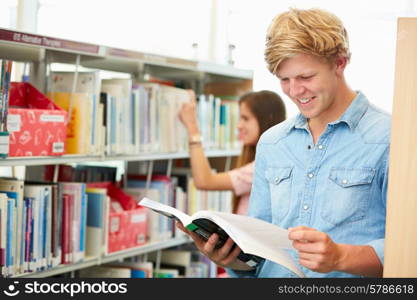 Two College Students Studying In Library