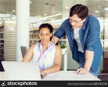 Two collegues working together in a office