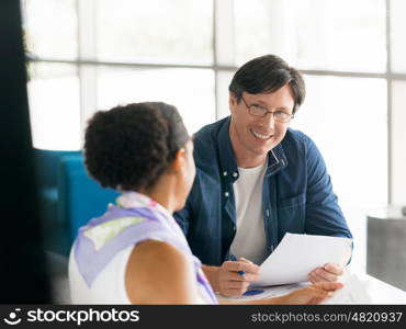 Two collegues working together in a office