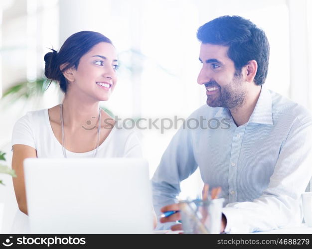 Two collegues working together in an office