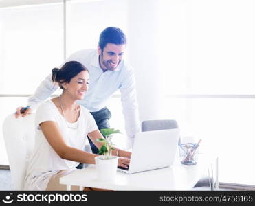 Two collegues working together in an office