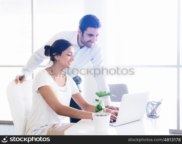 Two collegues working together in an office