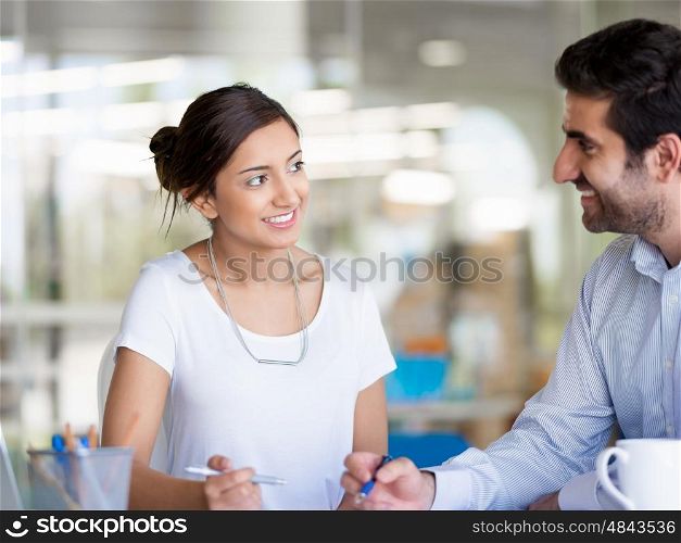 Two collegues working together in an office