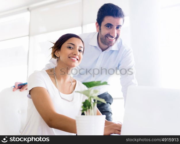 Two collegues working together in an office