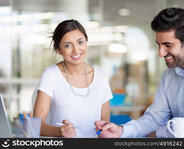 Two collegues working together in an office