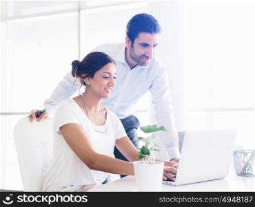 Two collegues working together in an office
