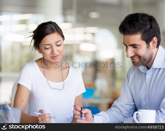 Two collegues working together in an office