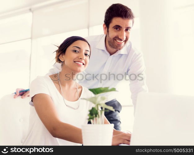 Two collegues working together in an office