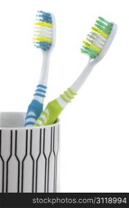two colorful toothbrushes isolated on white background