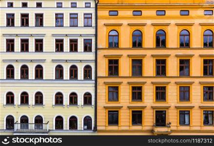 Two combined building facades, old European town. Summer tourism and travels, famous europe landmark, popular places and streets