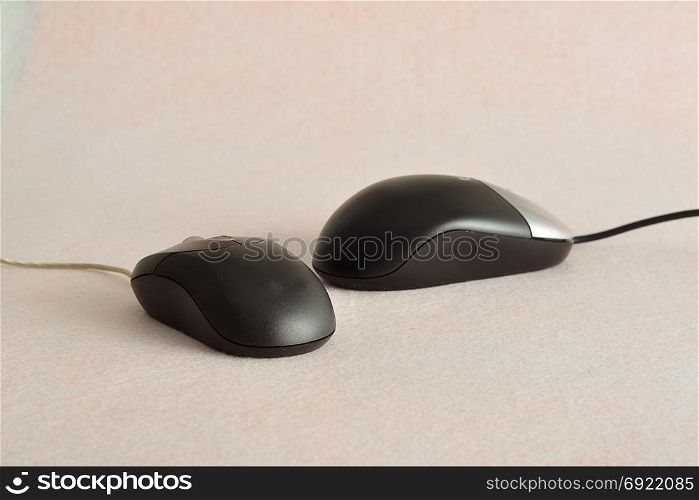 Two computer mouses isolated on a white background