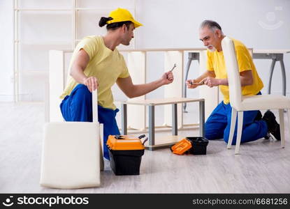 Two contractors carpenters working indoors 