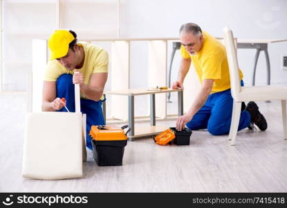 Two contractors carpenters working indoors 