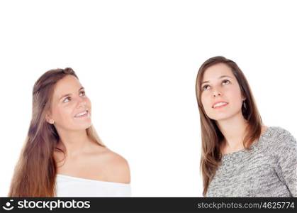 Two cool girl looking up isolated on a white background