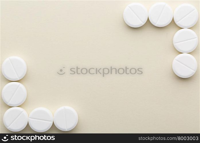 Two corners of white tablets. Two corners of white pills with copy space