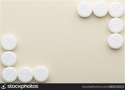Two corners of white tablets. Two corners of white pills with copy space