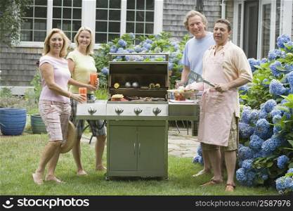 Two couples cooking food in an oven