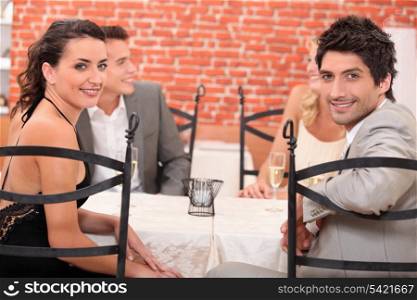 Two couples dining out