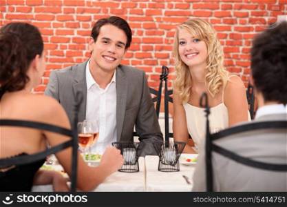 two couples in a restaurant
