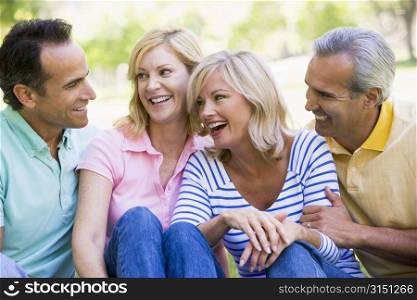 Two couples outdoors smiling