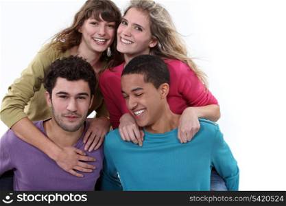 two couples posing together