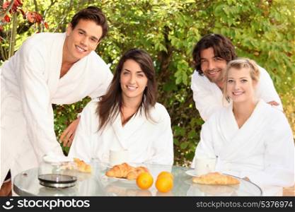 Two couples sharing breakfast