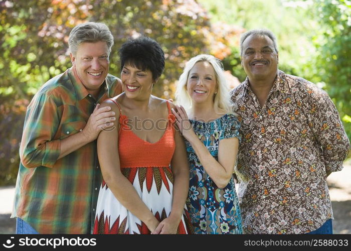 Two couples standing together and smiling