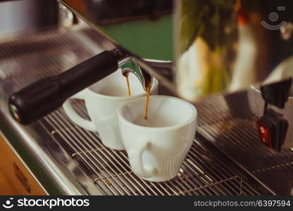 Two cups of coffee. Automatic coffee machine makes two fragrant coffee