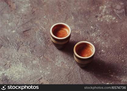Two cups of Coffee espresso . Two cups of coffee espresso on vintage brown slate with copy space,. Two cups of Coffee espresso