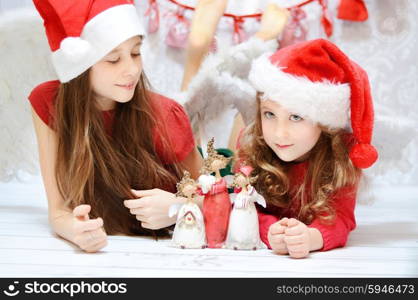 Two cute girls enjoying the christmas