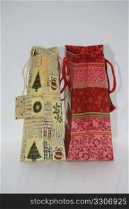 Two decorated christmas giftbags with name tags