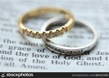 Two diamond wedding bands for a double bride wedding, on a bible verse